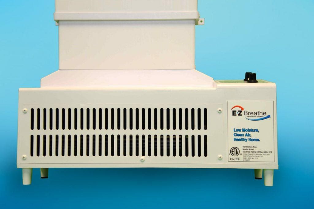 Close-up of an EZ Breathe (Taller Height), Basement Model A-400 – Standard chute – for walls up to 10′ ventilation system against a blue background. The device features a white body with a vented front panel and a small control knob on the top right corner.