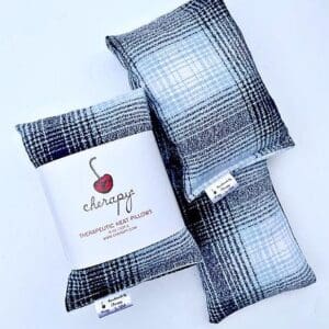 Three CHERAPY – Therapeutic Wrap Pillows (SUPER SOFT) in Blue and White Plaid Design with a label that says "Cherapy Therapeutic Heat Pillows.